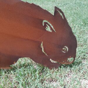 Lifelike rusted metal Wombat Garden Stake measuring 60cm x 42cm, made from Corten steel with a rustic patina for outdoor garden décor.
